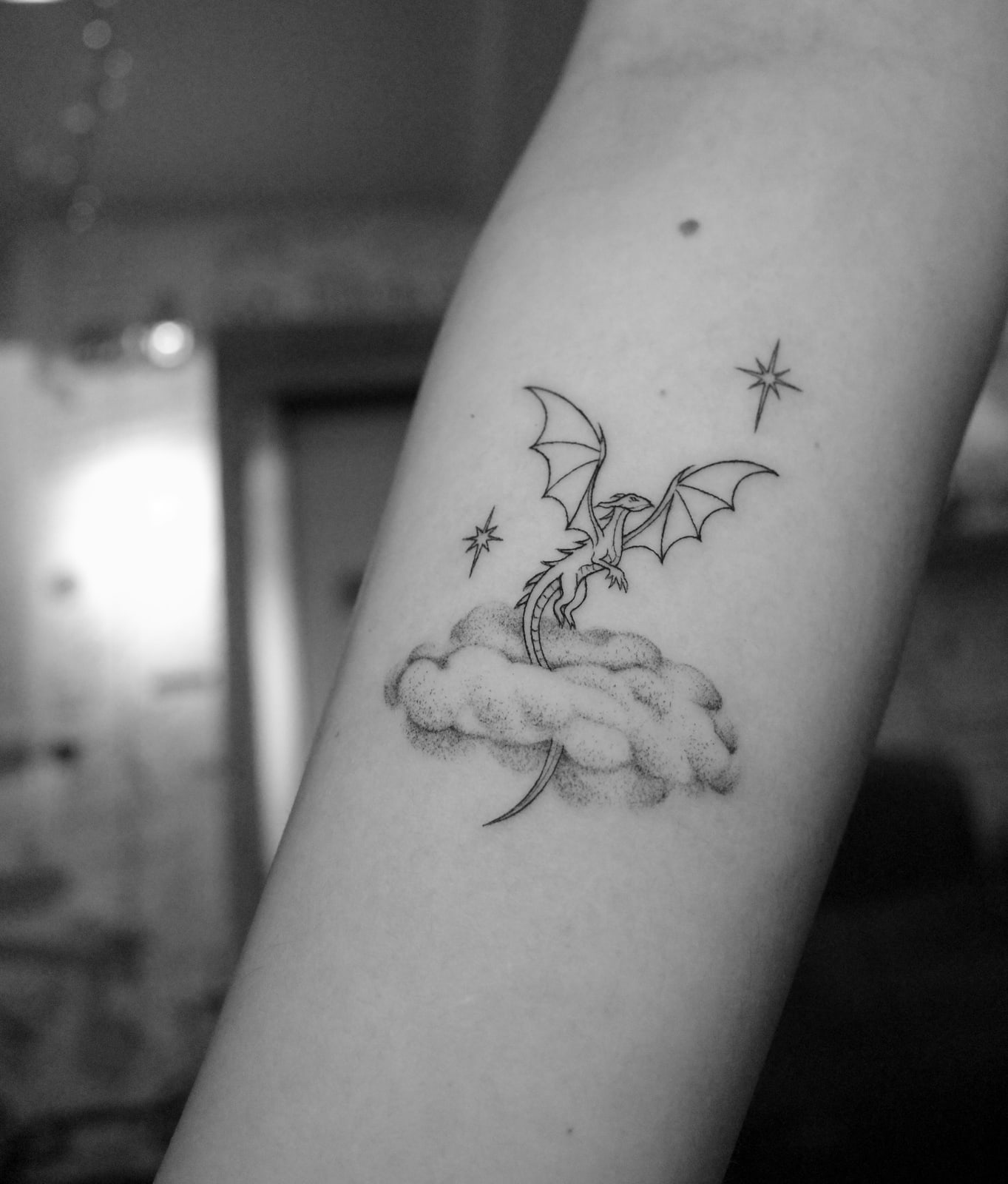 Dragon on a cloud, fine line tattoo on the forearm by Mike, STUDIO MIBO