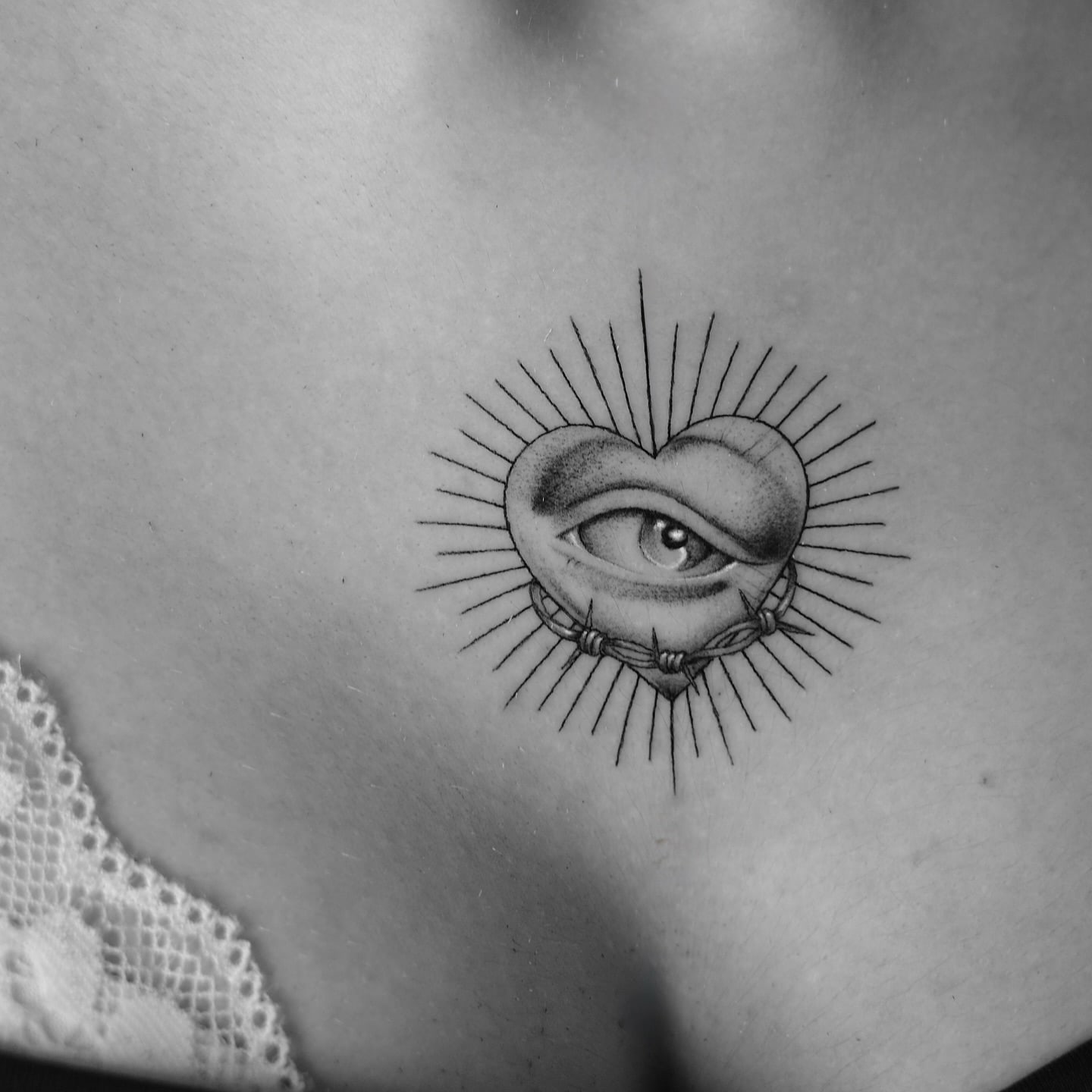 Heart with an eye, minimal — light shading tattoo on the chest by Mike, STUDIO MIBO